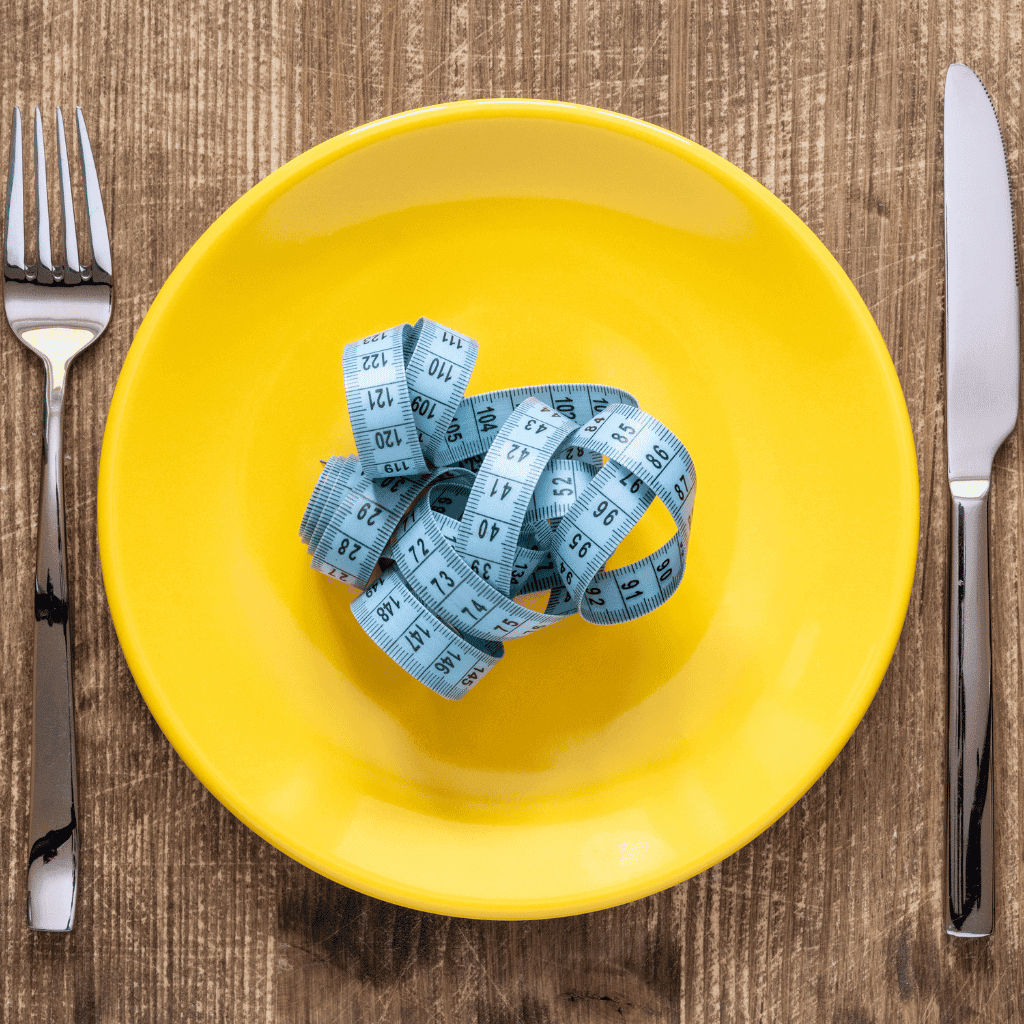 Blue measuring tape on a yellow plate